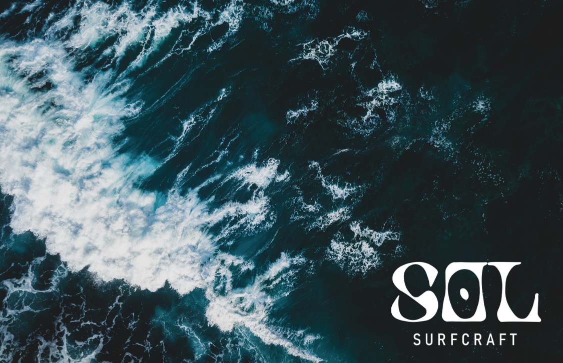 Sol Surfcraft brand identity over an aerial ocean wave photo
